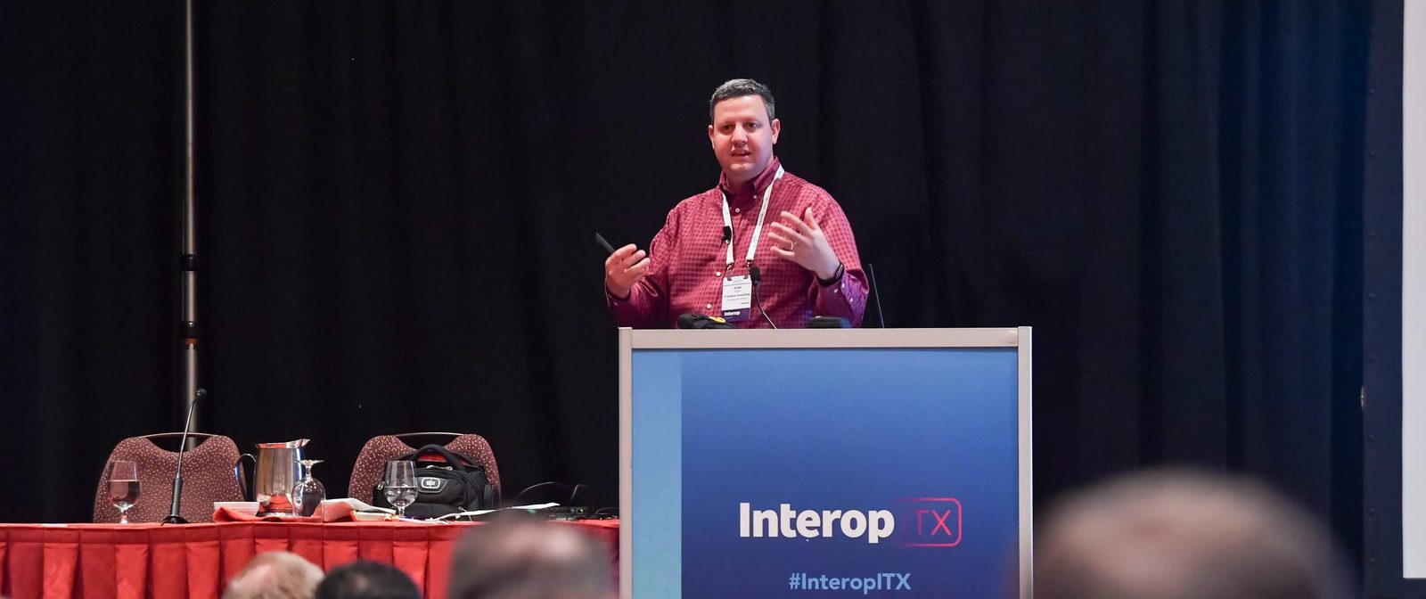 Drew Lentz presenting at the Interop ITX conference podium